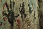 Crime Scene Photo Shows Eerie Handprint on Glass Window Next to Evidence Tape |