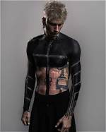 The Intricate Canvas: Machine Gun Kelly's Tattoos